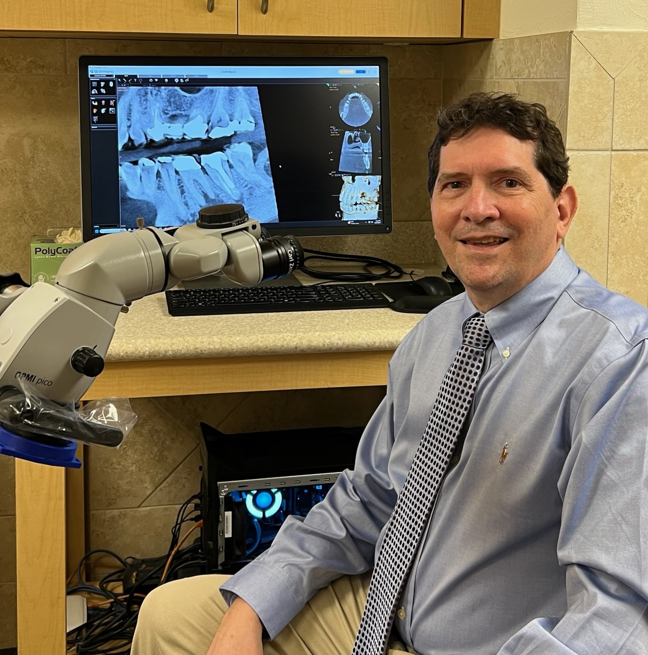 Dr. Duane Bernstein with endodontic microscope and digital imaging technology